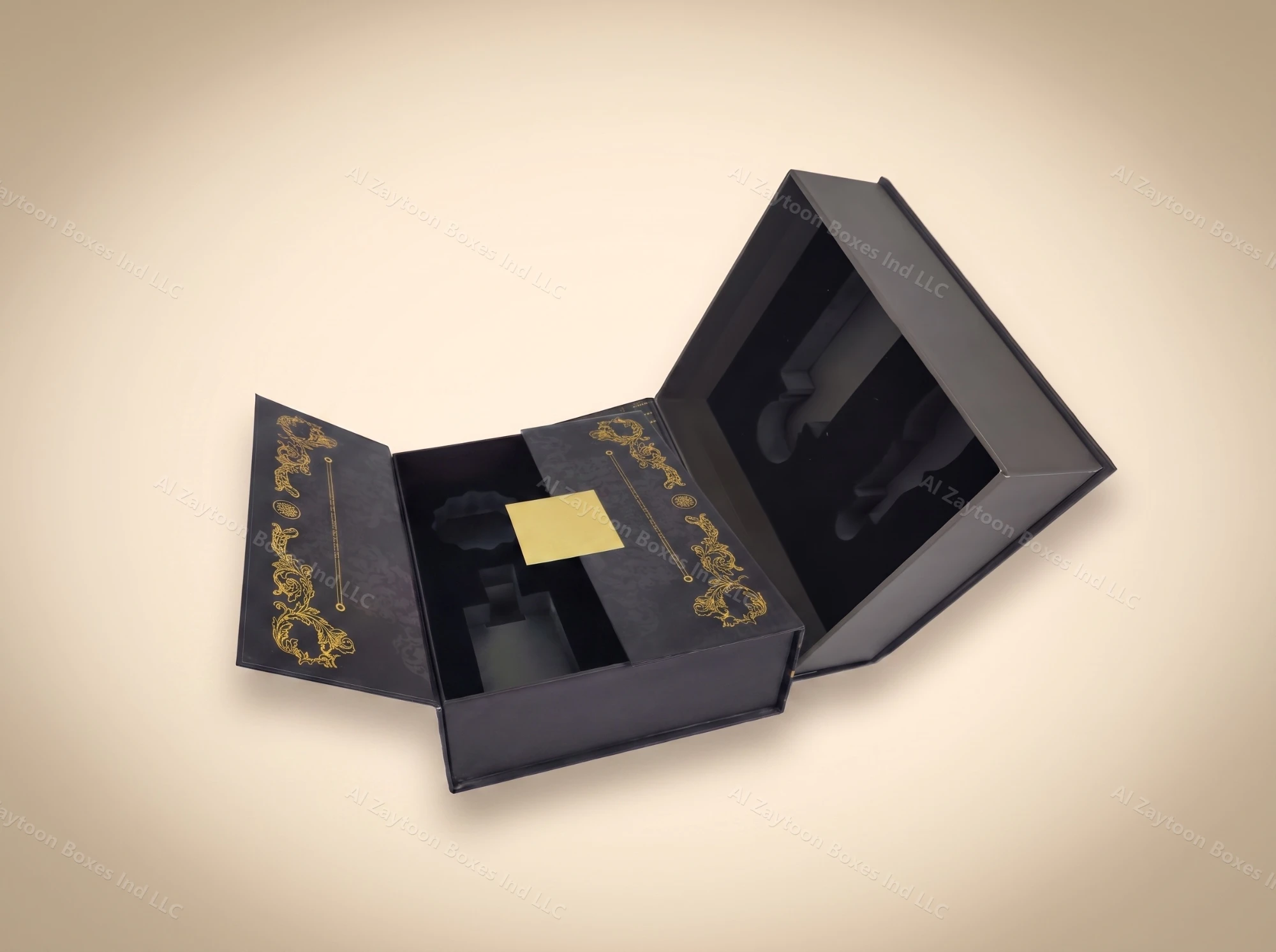 Black book-style perfume gift box with gold ornament and multi-compartment insert